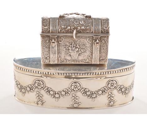 An Edwardian silver box, by Huttons, Birmingham 1907, embossed oval, with floral swag design, hinged cover, 5 1/4in. (13.5cms