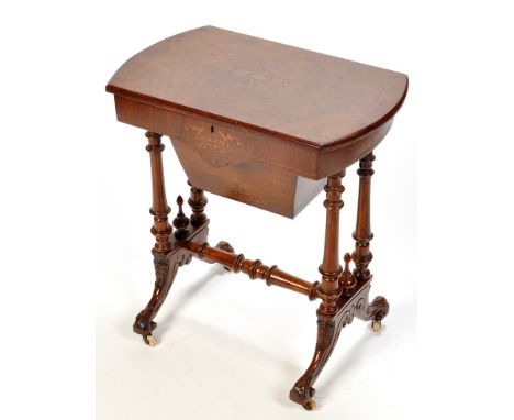 A Victorian burr walnut work table, the hinged rounded rectangular top inlaid with ebony, boxwood scrolling design and string
