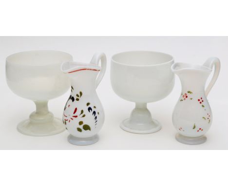 Two white glass sugar bowls on stems and two cream jugs of possible 'North-East' interest, the jugs with enamel painted decor