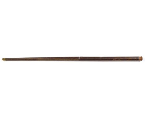 A straight muzzle load air cane, the brass ferule and ramrod with brown lacquer on a textured brass finish, later turned wood