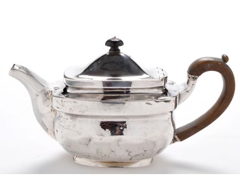 A George III teapot, by Anne Robertson, Newcastle, 1806, shaped rectangular with hinged cover, ebonised finial and compositio