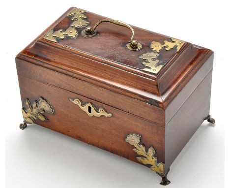A 19th Century mahogany tea caddy, with floral pattern brass mounts, the hinged lid with brass handle, raised on brass pad fe
