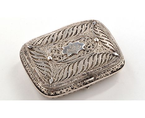A white metal filigree pattern cigarette case, decorated overall in scrollwork designs centred by a panel with arabic script,
