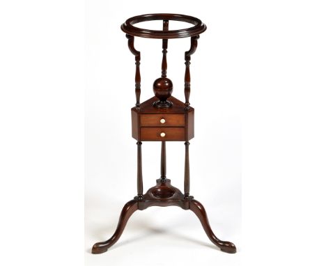 A George III style basin stand, the moulded rim raised on shaped turned supports, triform undertier, fitted covered cup shape