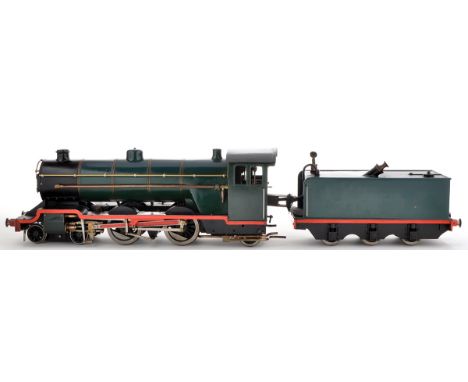 A scratch built live steam model locomotive and tender, 4-4-2 at 3in. gauge, painted black, blue and green, loco 21in. (54cms