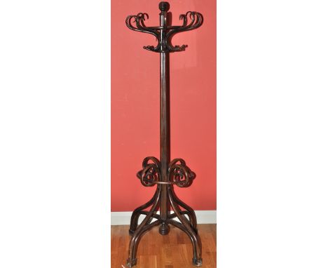 An early 20th Century stained Bentwood hat and coat stand, the turned reeded finial on quatrefoil tapering column fitted eigh