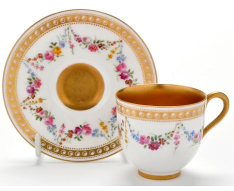 Royal Worcester miniature cup and saucer, painted with floral swags, height 5.1cms, printed lilac mark for 1913; W9324.  (2)
