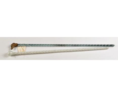 Spiral glass walking stick, with gilt metal 'dog head' terminal, length 93cms; spiral glass walking stick, length 89cms. (2)