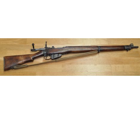 A WW1 Long Branch No. 4 Mark I rifle, .303 cal., the full length stock held by single band, proof marks to lock no. 2L8964, a