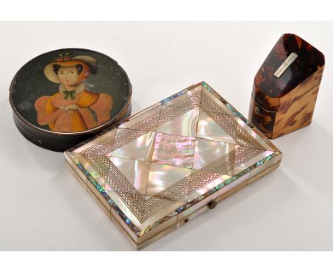 An early 19th Century circular papier mache snuff box, the cover painted naive portrait of a lady wearing yellow hat and scar