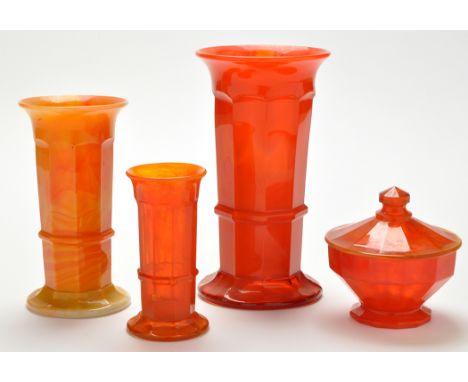 Three graduated variegated amber glass vases of 'North-East' interest, cylindrical form with nine panel faceted sides, the ta