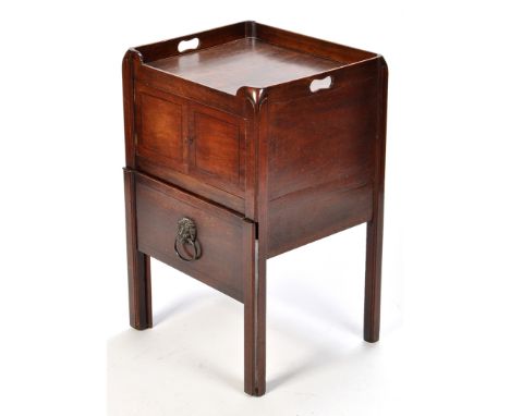 A George III mahogany commode, the square top surmounted by three quarter gallery with cut-out handles, a pair of fielded pan