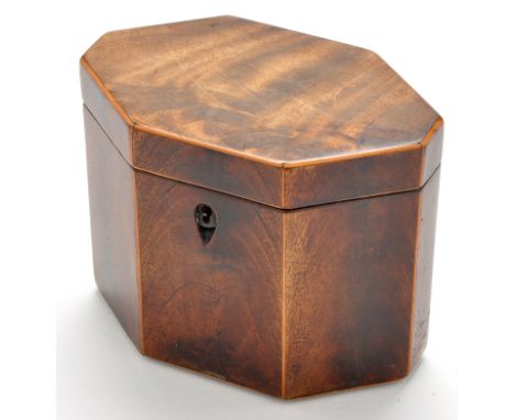 A George III mahogany tea caddy, of octagonal form with boxwood stringing, 6 x 3 1/2 x 5in. (15 x 9 x 12cms) high.
See illust