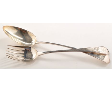 A George III salad fork, probably by John Lamb, London 1783, Old English pattern and engraved crest within shield; and a Geor
