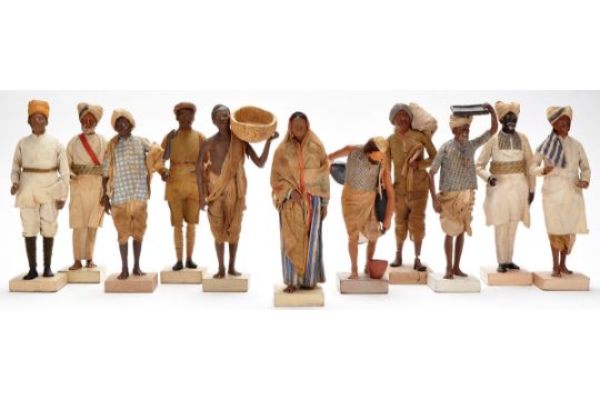 Eleven Indian clay figures, depicting servants and tradesmen, including  water carrier, laundry ma