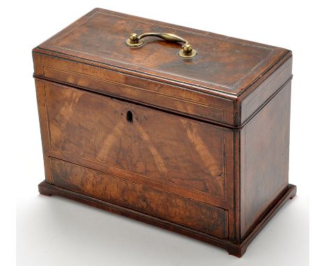 A George III walnut tea caddy, of rectangular form, decorated with boxwood and ebonised stringing, the hinged lid with brass 