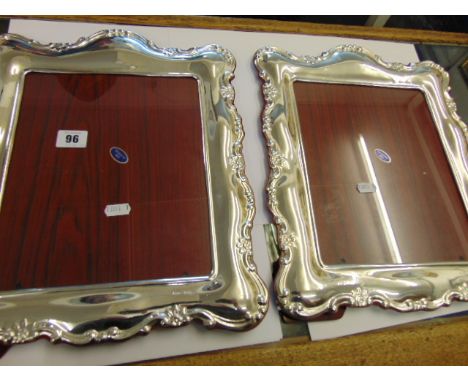 A pair of hall marked Silver photo frames, 40cm x 30