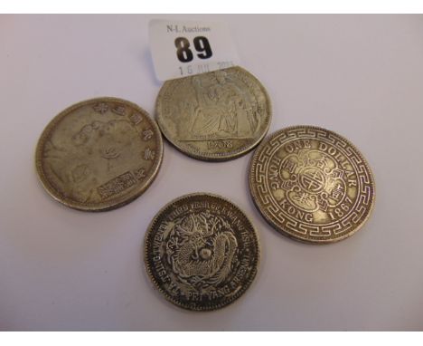 Four Chinese coins, possibly Silver