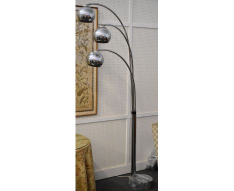 A designer chrome three branch standard lamp on a veined grey marble circular base