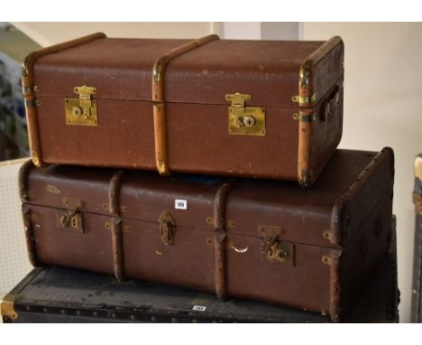 Two vintage banded travel trunks, one bearing old P & O Orient Lines and Britain by P & O travel stickers