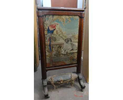 A Victorian rosewood firescreen with pictorial sampler panel and padded footrest on sweeping supports