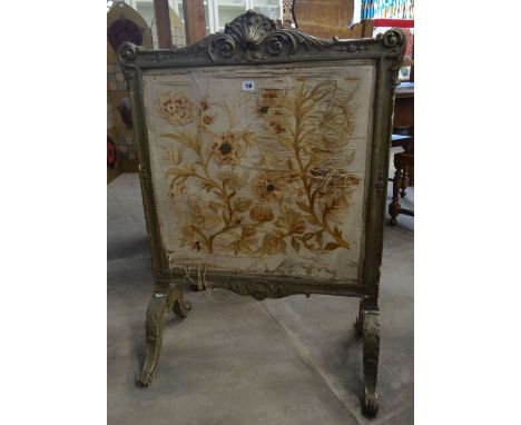 An antique Rococo style firescreen with embroidery panel and acanthus leaf decoration
