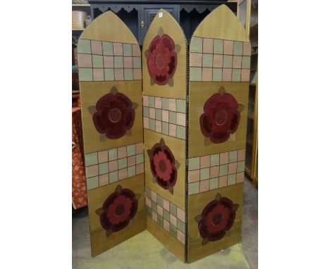 A three fold silk covered studded ogee top firescreen with heraldic facade and heraldic obverse and rosette reverse