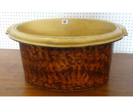 A sponged metallic farmhouse twin handled basin, 50cms wide