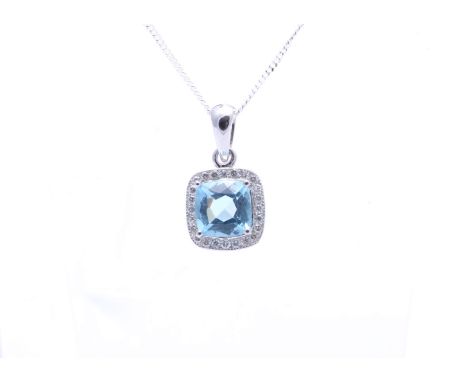 One cushion cut blue topaz gemstone is surrounded by a halo of diamonds to create this gorgeous 9ct white gold pendant. This 