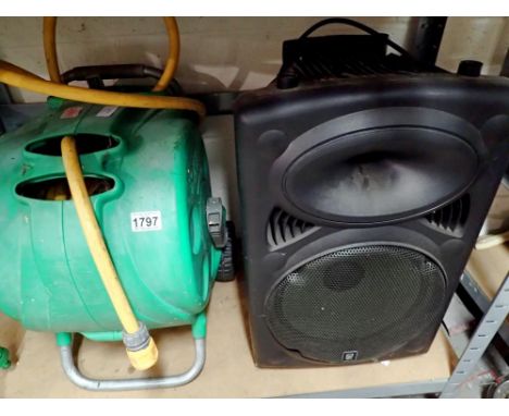 Hozelock hose on wheels, wheelbarrow, spade and shears. Speaker not included in sale. Not available for in-house P&amp;P 