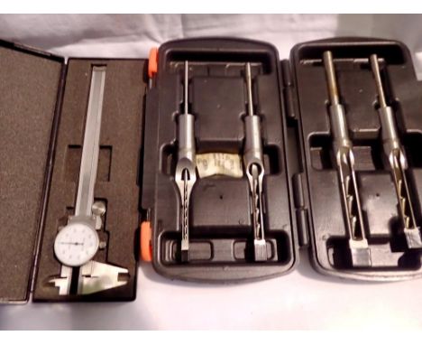 Four piece mortice chisel set and a dial caliber.  Not available for in-house P&amp;P 