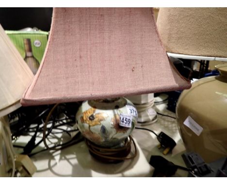 Small ceramic based table lamp painted with flowers with a pink shade, H: 42 cm. All electrical items in this lot have been P