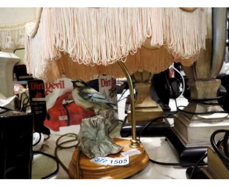 Table lamp on an oak stand with Giuseppe Armani ceramic bird and shade, H: 50 cm. All electrical items in this lot have been 