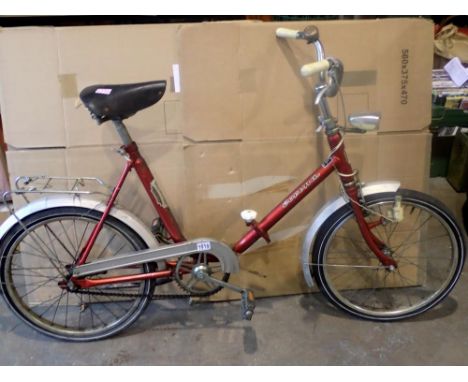 Corona red single speed folding bike, flat tyres, light chrome oxidation, mudguards in tact, dynamo lights, front break funct