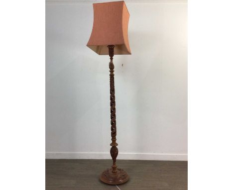 EASTERN CARVED WOOD STANDARD LAMP,with shade, the column pierced and carved with serpents, 190cm high, along with a mahogany 