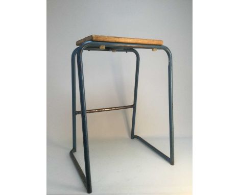 SET OF THREE INDUSTRIAL/INSTITUTIONAL STACKING STOOLS,with wooden plank seats and raised on light blue painted tubular metal 
