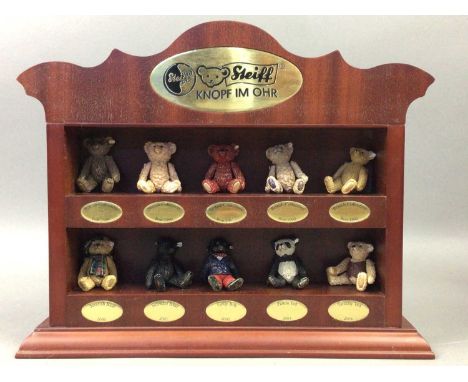 GROUP OF TEN MINIATURE STEIFF BEAR FIGURES,along with a Steiff display rack (11)