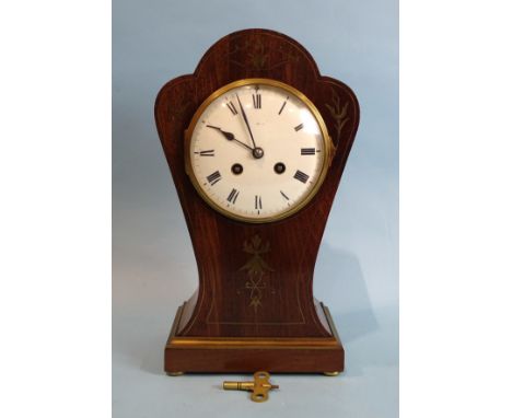 A 19th century mahogany and brass inlaid balloon-shaped mantel clock with enamel dial, Roman numerals, the movement stamped S