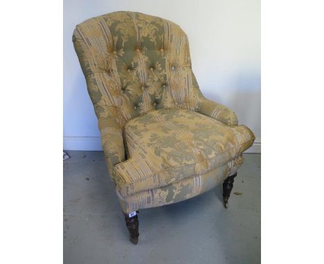 A Victorian button back upholstered fireside chair, 100cm tall x 69cm wide 