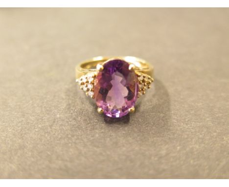A 9ct yellow gold amethyst and diamond ring, size P 1/2, hallmarked, amethyst approx 14mm x 10mm x6.5mm, in good condition 
