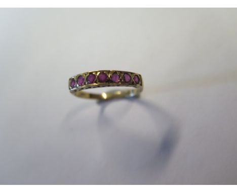 A 9ct yellow gold ruby half eternity ring with 7.2mm round rubies, size S, approx 1.8 grams, generally good some small abrasi