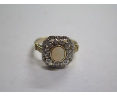 A 9ct yellow gold opal and diamond ring, size approx M 1/2, in good condition 