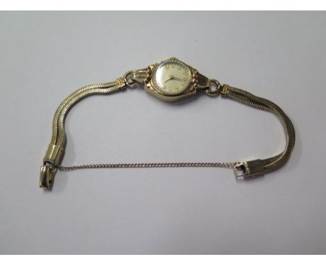 A ladies 9ct gold manual rotary watch on 2 row plated snake bracelet, running, total weight approx 13.8 grams 