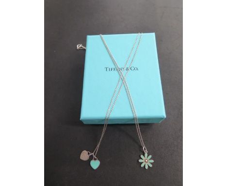 Two enamel Tiffany pendants and a heart pendant on 42cm chains, all generally good, some minor usage marks 