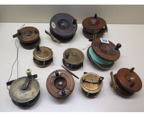 Ten assorted brass and wooden vintage fishing reels, largest 10cm, all unnamed 