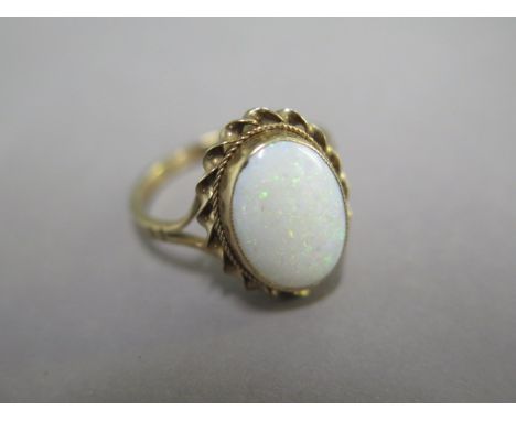A 9ct yellow gold opal ring, size P, opal approx 14mm x 10mm x 3.5mm, generally good, approx 2.8  grams 