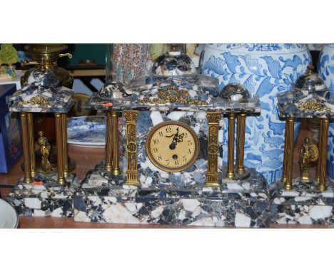 A large late 19th century veined marble and gilt brass mounted clock garniture of architectural form, the clock with paper di