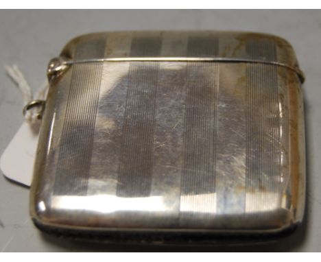 An Edwardian silver vesta having engine turned decoration