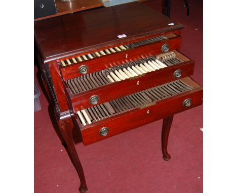 A circa 1920s Mappin &amp; Webb mahogany fitted canteen table having three drawers containing complete12 place setting compri