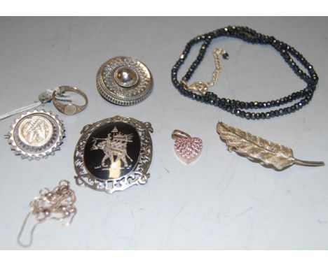 A small quantity of silver and white metal jewellery to include a filigree leaf brooch, two necklaces, two late 19th/early 20